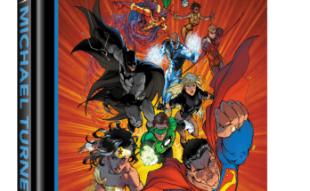 The DC Art of Michael Turner deluxe hardcover art book featuring DC heroes including Superman, Batman, Wonder Woman, Supergirl, The Flash, Green Lantern, and more.